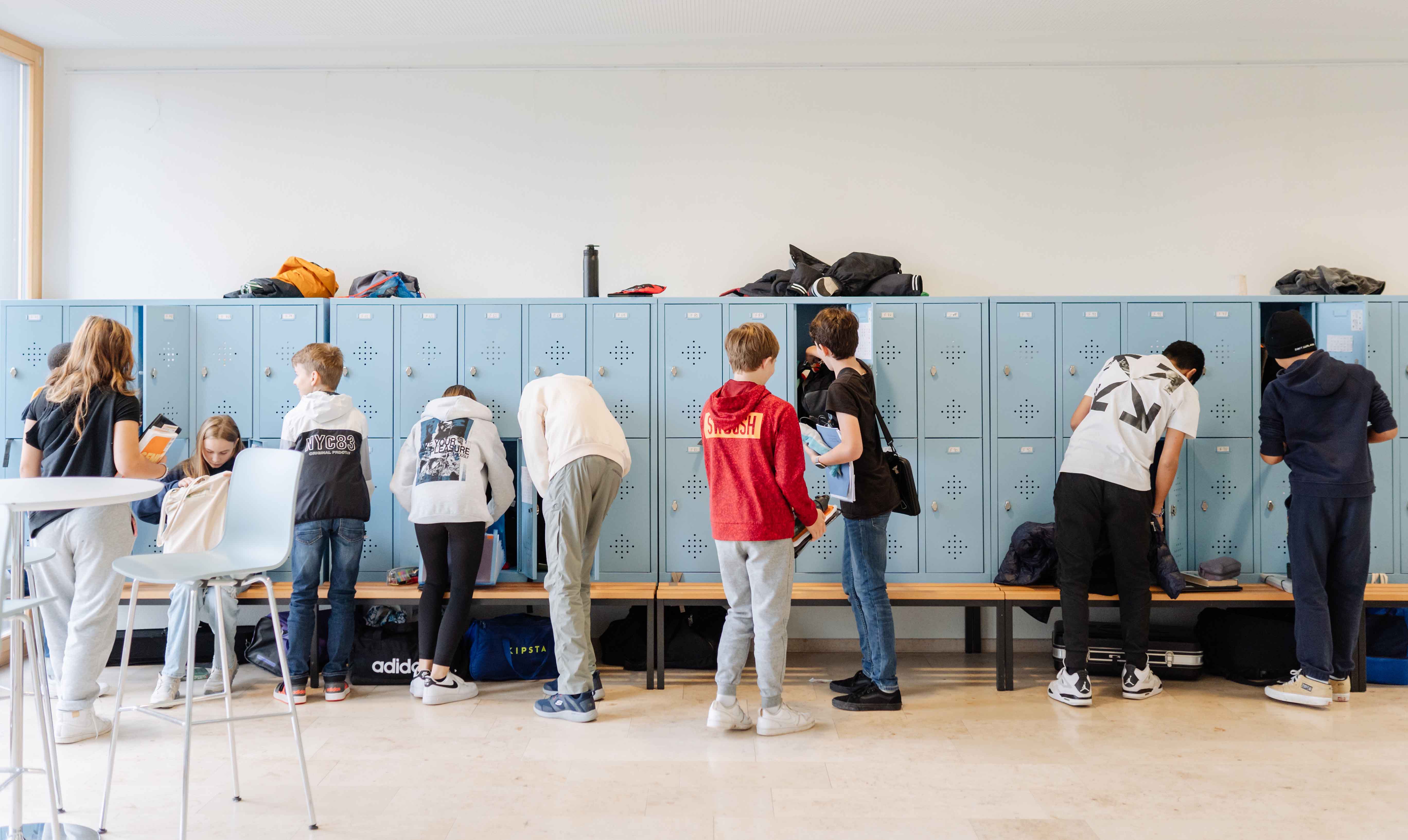 Student watering plants in the school garden
