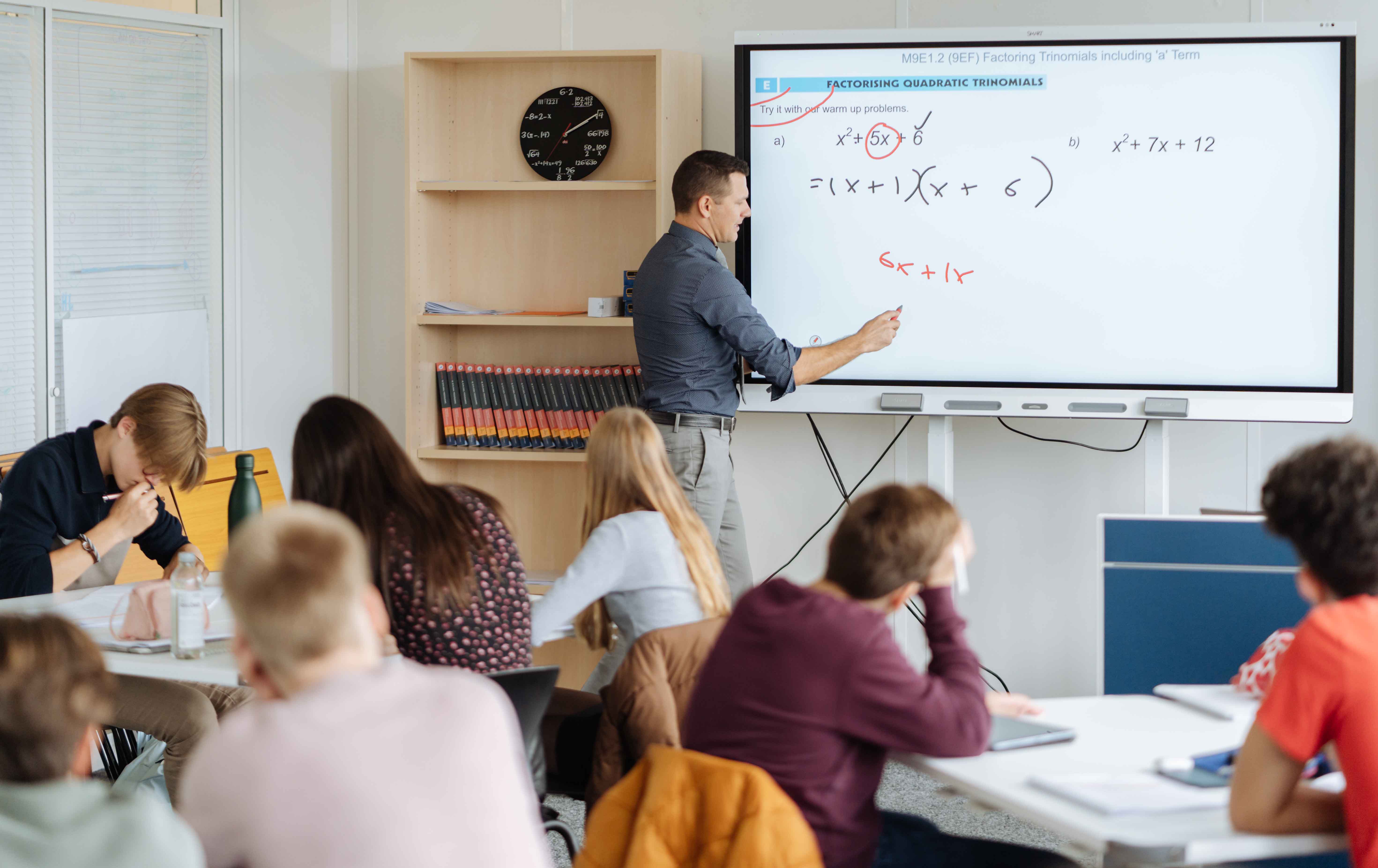 Student watering plants in the school garden